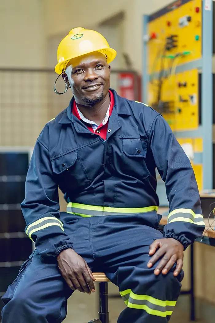 Trainee in safety gear at a solar training lab during the solar installer course in Kenya